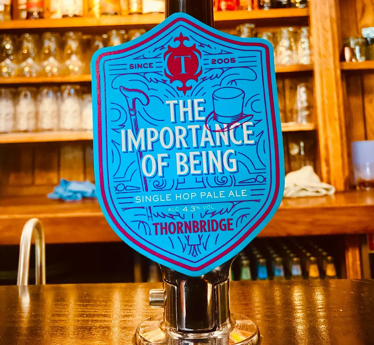 The Importance of Being is a refreshing 4.3% single hop pale ale from Thornbridge Brewery, now available on tap at the Wheatsheaf Cowshed. This beer is crafted using the distinctive Ernest hop, known for its bold flavor profile featuring aromas of apricot and tangerine, complemented by refreshing notes of lemon and light herbal spice<br />
THORNBRIDGE BREWERY</p>
<p>UNTAPPD<br />
. It's a great choice for those looking to enjoy a flavorful and aromatic pale ale!